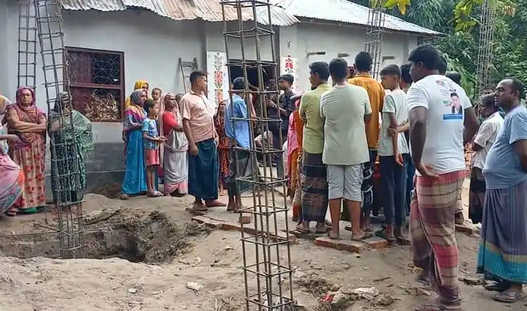 Bangladeshi people gather outside a house after a fire incident. Channel i News - চ্যানেল আই নিউজ
